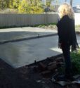 Thumbnail of inspecting concrete pad for new purpose built office and archaeology lab