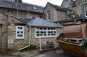 Thumbnail of W elevation, 19th century addition to N end of Hall’s E wing, with modern additions, looking SE