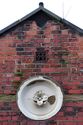 Thumbnail of Entrance Block, south elevation, medallion and vent to western gable, looking N