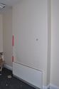 Thumbnail of Entrance Block, room G6 (former Receiving Officer’s waiting room), chimney breast, looking SW