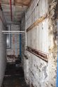 Thumbnail of Southern engine house, lower east elevation revealed in north-south passage, looking S