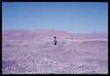 Thumbnail of Woman carrying a load on her head. Low desert to the NW of the trench ZWE at Zawaydah (Naqada). View from the SE (1982 winter or autumn season). <br  />(<b>Filename:</b> nq_ads_262.jpg)