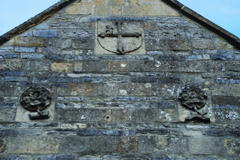 The Bath stone panels in the West gable of St Patrick's Chapel