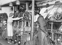 Thumbnail of Female workers spinning aeroplane cord on machines at Craddocks Wire Rope Factory (Wakefield), 23rd August 1916. IWM (Q 109940)