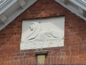 Thumbnail of Spalding Drill Hall, hall and indoor rifle range behind, used as a base for F Company 4th Battalion Lincolnshire Regiment (Haverfield Road/Priory Road, Spalding, South Holland, Lincolnshire). Sphinx above entrance.