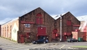 Thumbnail of Royal Naval Torpedo Factory (Eldon Street, Fort Matilda, Gourock, Inverclyde), the surviving buildings of larger complex comprise multi-bay brick single storey factory units. East elevation.