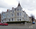 Thumbnail of Balmoral Hotel used as Red Cross hospital during First World War returned to hotel in inter-war period (Trinity Square, Charlton Street, Llandudno, Conwy, Clwyd). Front and side elevation.