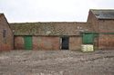 Thumbnail of Northeast elevation of Building C (right centre) with break in fabric where it was later extended by Building E (left centre), looking SW