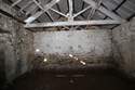 Thumbnail of Byre north wall with joist holes for feeder