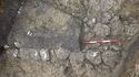 Thumbnail of Tr6 Stone drain (607) – part excavated, 1x0.5m NB