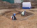 Thumbnail of The slumped fills of the former mound, collapsed into the chamber, being photo cleaned by mike house & andy leonard.