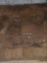 Thumbnail of General view of north side of chamber, following the initial block lifting of the suspended grave goods. The photo shows the filtration deposits around the decayed coffin [229], with the fe folding stool <6> and the large cu cauldron <5> at either end.
