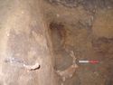 Thumbnail of The two fe hooped buckets <8> & <9> in the south-east corner of the burial chamber (from above), with fe hook <51> in east wall of chamber  visible in bottom left hand corner of the photo.