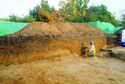 Thumbnail of Original section across the eastern edge of the chamber grave and its collapsed mound being cleaned for recording