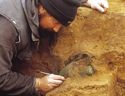 Thumbnail of The bronze flagon under excavation