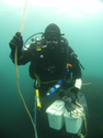 Thumbnail of Diver ascending with sediment samples