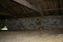 Thumbnail of The upper west elevation of Barn 2, the blocked air vent can clearly be seen, as can the repairs above each opening and the fact the elevation has clearly been lowered; from the north-east.
