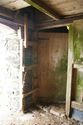 Thumbnail of The doorway in the partition wall and ladder to the loft in Barn 2; from the south-east.