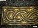 Thumbnail of Catalogue no 558. Strip-mount,gold and garnet cloisonné, filigree serpent mounts. K1741 detail 