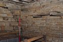 Thumbnail of Ground floor of cart-shed, looking towards east corner, with oak brackets in wall