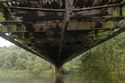 Thumbnail of Bridge deck underside looking SW, transverse timbers, spine, and bracers. Report plate 105.