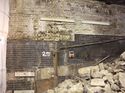 Thumbnail of Lower section of Retaining wall with scars of vehicle impacts